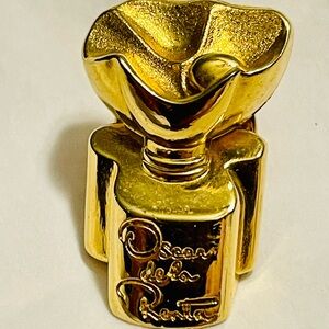 Vintage Oscar De La Renta perfume bottle lapel pin or brooch